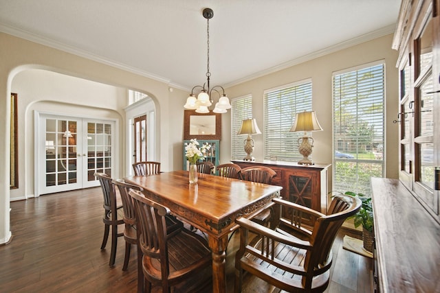 3207 Summerwind Ct, Pearland, TX 77584 - dining space with arched walkways, a chandelier, dark wood-style floors, french doors, and plenty of natural light