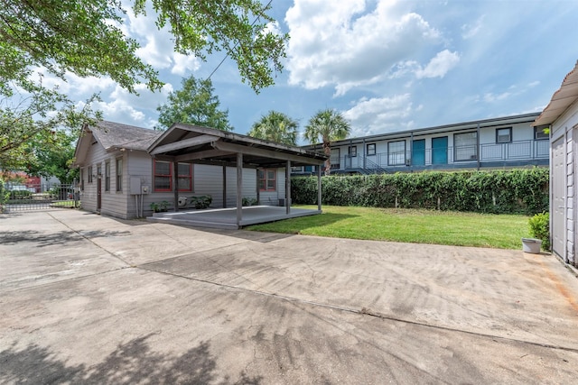 2027 Huldy St, Houston, TX 77019 - view of front of property featuring a front lawn and a carport