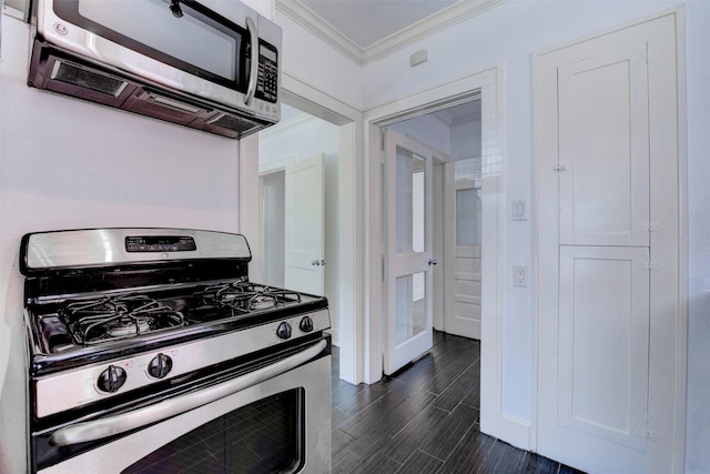 2027 Huldy St, Houston, TX 77019 - kitchen featuring stainless steel appliances, crown molding, and wood tiled floors