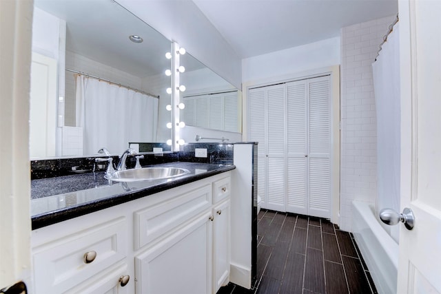 2027 Huldy St, Houston, TX 77019 - full bath featuring vanity, a closet, and shower / tub combo with curtain