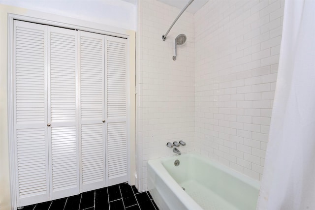 2027 Huldy St, Houston, TX 77019 - bathroom featuring a closet, shower / bath combo with shower curtain, and tile patterned flooring