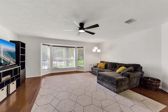 17214 Palm Falls Ct, Houston, TX 77095 - living room featuring wood finished floors, ceiling fan, and a textured ceiling