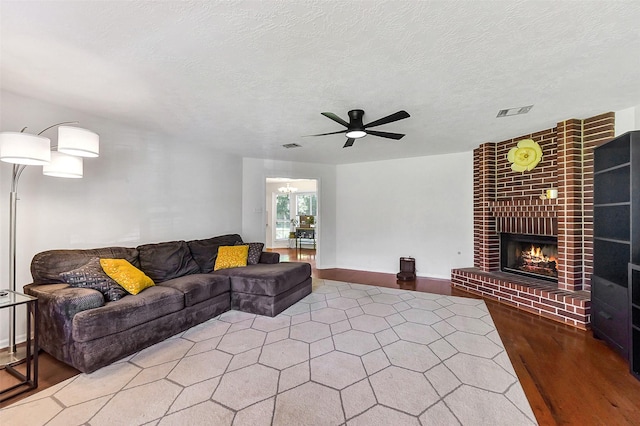 17214 Palm Falls Ct, Houston, TX 77095 - living area featuring a ceiling fan, a brick fireplace, and wood finished floors