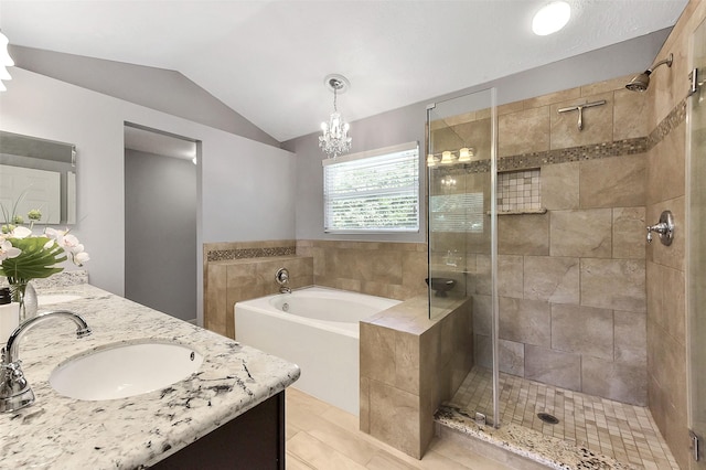 17214 Palm Falls Ct, Houston, TX 77095 - bathroom with double vanity, a bath, a stall shower, vaulted ceiling, and tile patterned flooring