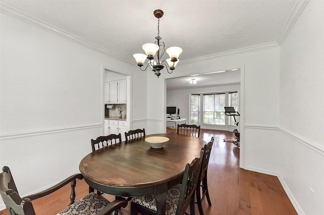 17214 Palm Falls Ct, Houston, TX 77095 - dining room with a chandelier, ornamental molding, and wood finished floors