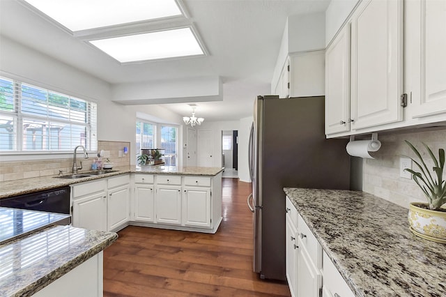 17214 Palm Falls Ct, Houston, TX 77095 - kitchen featuring a chandelier, decorative backsplash, white cabinets, and dark wood-style flooring
