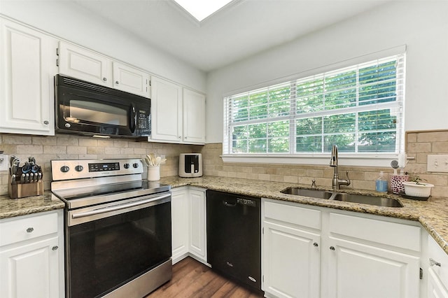 17214 Palm Falls Ct, Houston, TX 77095 - kitchen with black appliances, white cabinets, tasteful backsplash, dark wood finished floors, and light stone counters