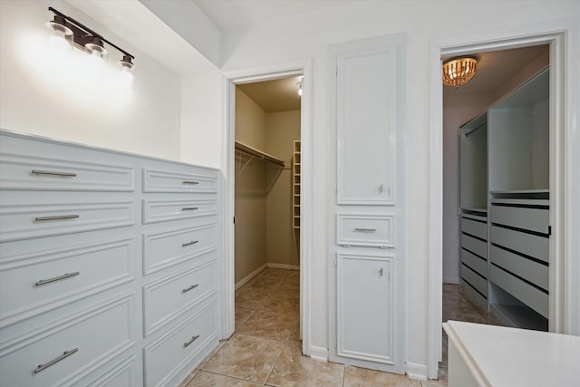 1003 Kemberton Dr, Houston, TX 77062 - walk in closet with light tile patterned floors