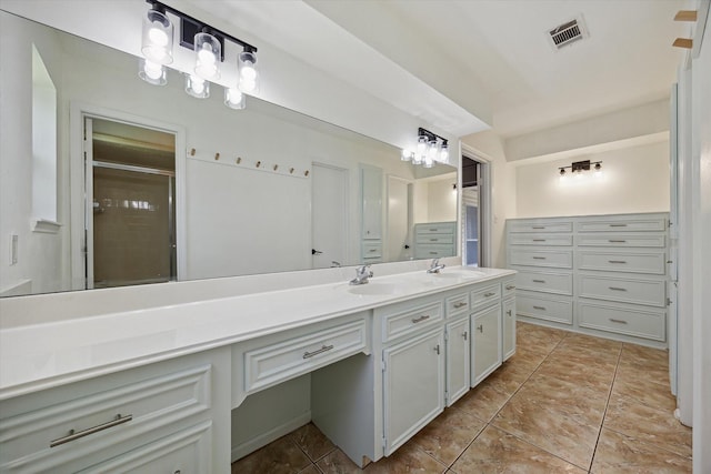 1003 Kemberton Dr, Houston, TX 77062 - full bathroom featuring double vanity, a shower with door, and a closet