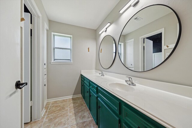 1003 Kemberton Dr, Houston, TX 77062 - full bathroom with double vanity and baseboards