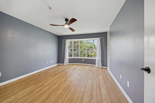 1003 Kemberton Dr, Houston, TX 77062 - spare room featuring wood finished floors, a ceiling fan, and a smoke detector