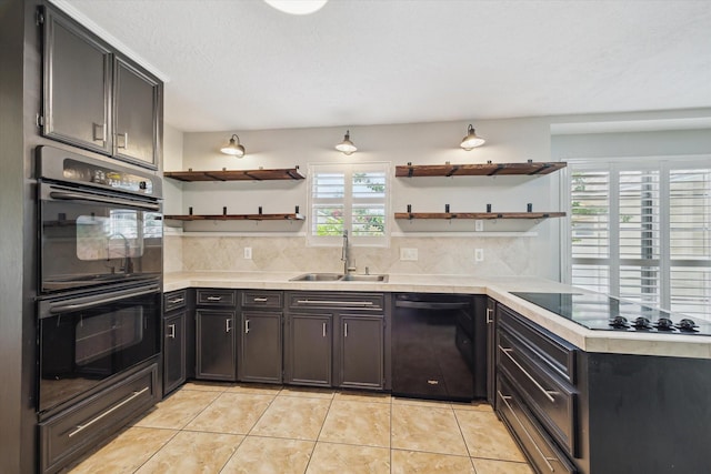 1003 Kemberton Dr, Houston, TX 77062 - kitchen featuring black appliances, open shelves, light tile patterned floors, and light countertops