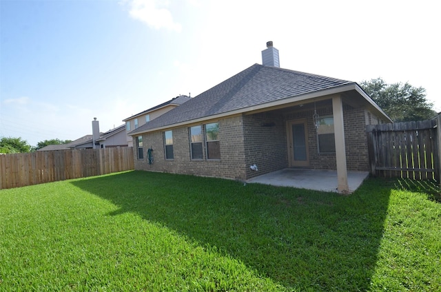 21514 Colton Cove Dr, Houston, TX 77095 - rear view of property featuring brick siding, a patio area, and a fenced backyard