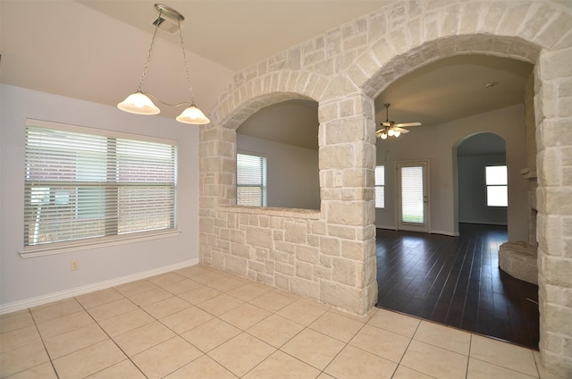 21514 Colton Cove Dr, Houston, TX 77095 - tiled empty room featuring arched walkways and ceiling fan