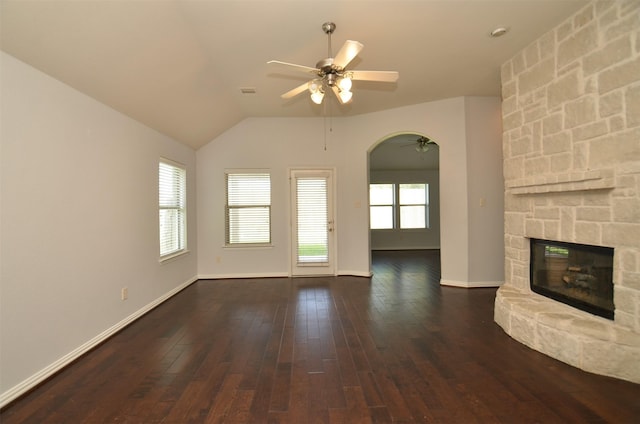 21514 Colton Cove Dr, Houston, TX 77095 - unfurnished living room featuring a ceiling fan, dark wood-style floors, a stone fireplace, and lofted ceiling