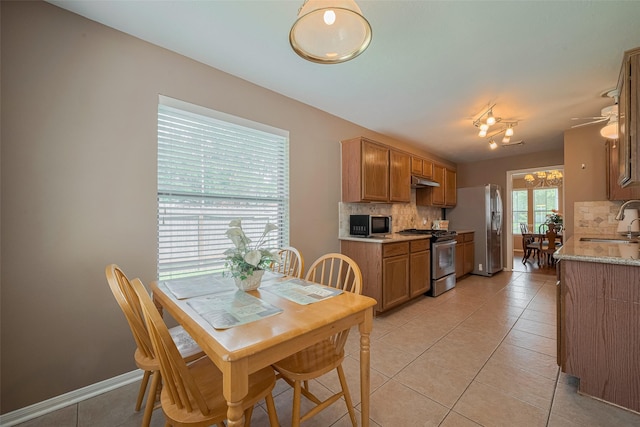 21619 Oakcreek Ct, Katy, TX 77450 - dining room with light tile patterned floors and ceiling fan