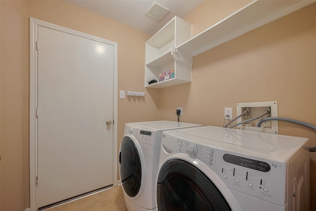 21619 Oakcreek Ct, Katy, TX 77450 - laundry area featuring independent washer and dryer and light tile patterned floors