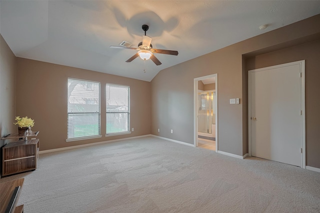 21619 Oakcreek Ct, Katy, TX 77450 - unfurnished bedroom with light carpet, ensuite bathroom, a ceiling fan, and vaulted ceiling