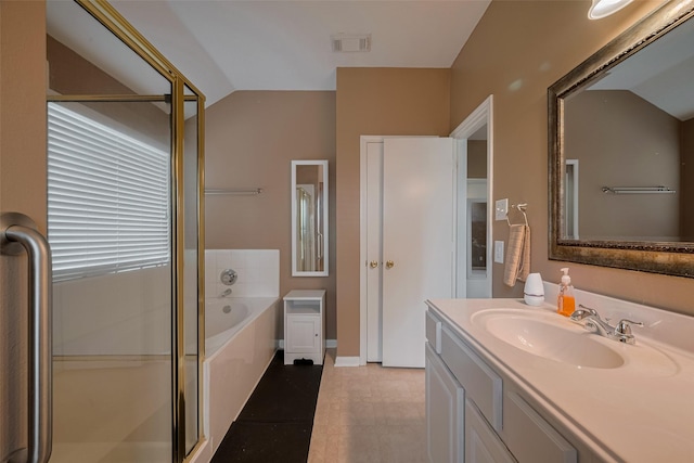 21619 Oakcreek Ct, Katy, TX 77450 - bathroom featuring vanity, a garden tub, lofted ceiling, a shower stall, and tile patterned flooring