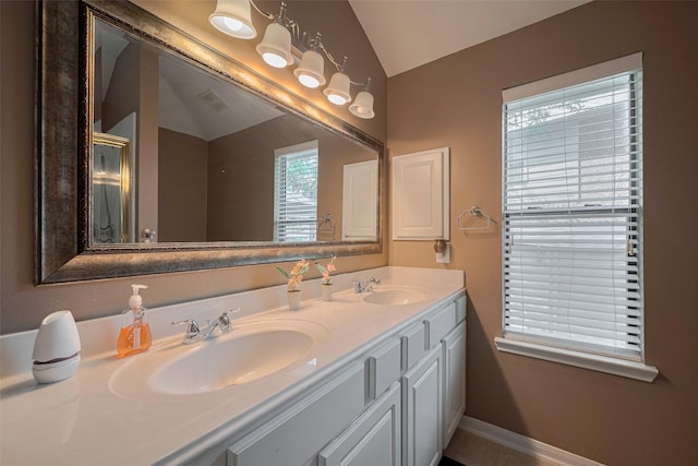 21619 Oakcreek Ct, Katy, TX 77450 - full bath featuring vaulted ceiling, double vanity, and an enclosed shower