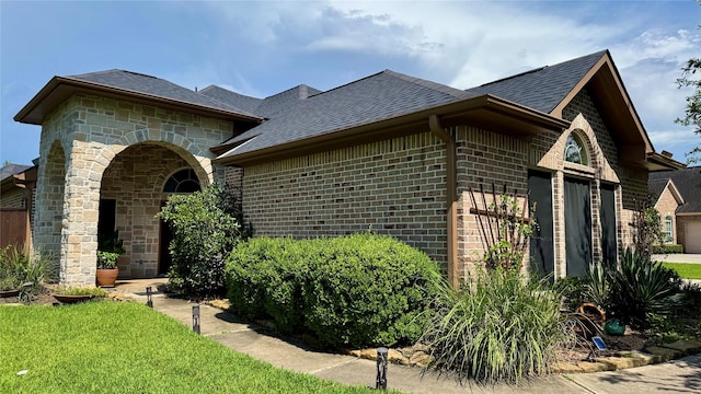 8110 Hideaway Run Way, Spring, TX 77389 - view of front of property with a garage, brick siding, a shingled roof, and stone siding