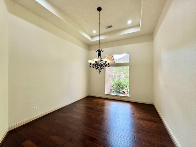 8110 Hideaway Run Way, Spring, TX 77389 - spare room with a raised ceiling, dark wood finished floors, a chandelier, and recessed lighting