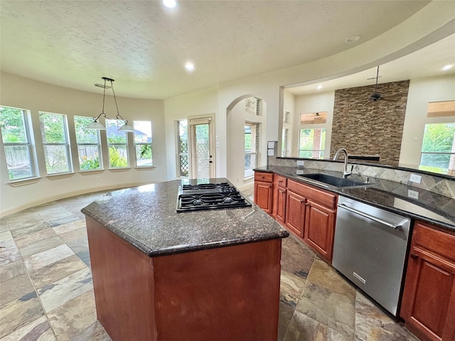 8110 Hideaway Run Way, Spring, TX 77389 - kitchen with stone tile floors, dishwasher, open floor plan, recessed lighting, and a textured ceiling