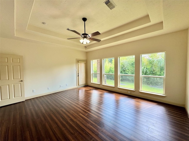 8110 Hideaway Run Way, Spring, TX 77389 - unfurnished room with a raised ceiling, dark wood-style floors, and a ceiling fan