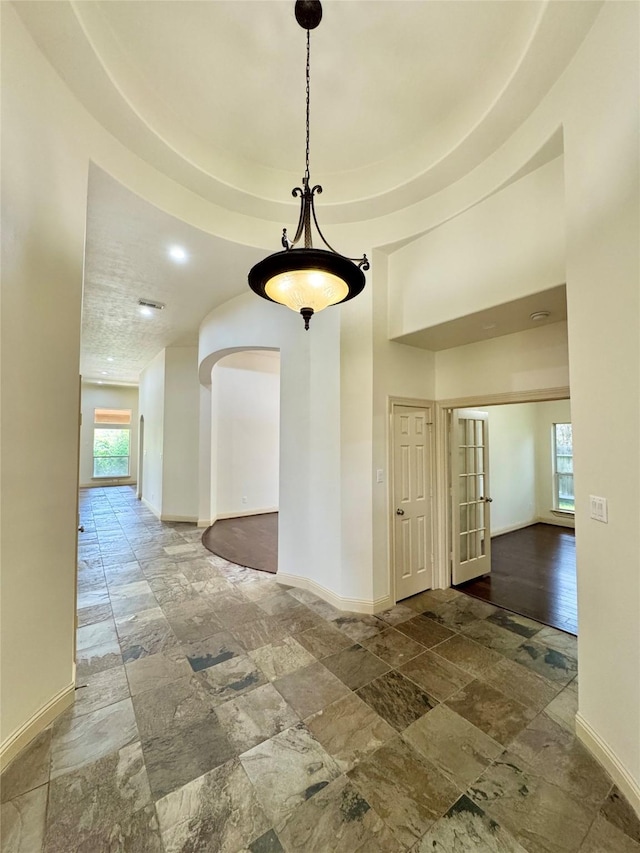 8110 Hideaway Run Way, Spring, TX 77389 - unfurnished dining area with stone tile floors and baseboards