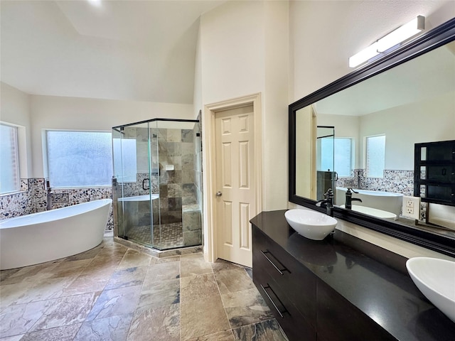 8110 Hideaway Run Way, Spring, TX 77389 - full bath with double vanity, a freestanding bath, a shower stall, and stone finish flooring