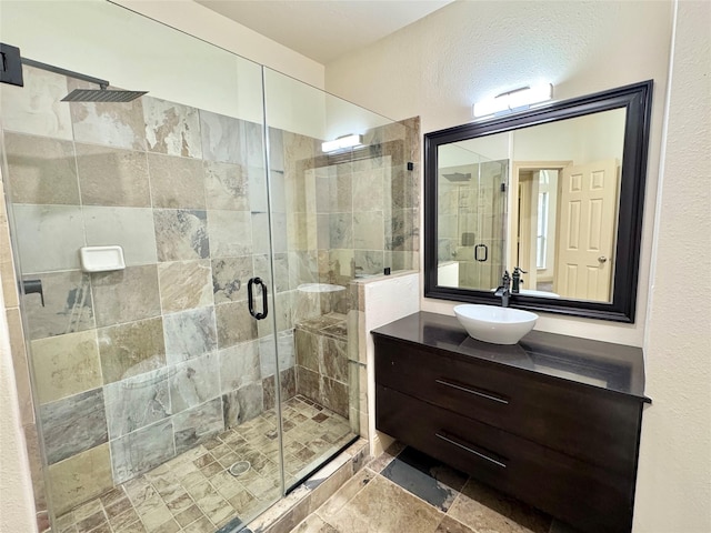 8110 Hideaway Run Way, Spring, TX 77389 - bathroom featuring vanity, a stall shower, and a textured wall