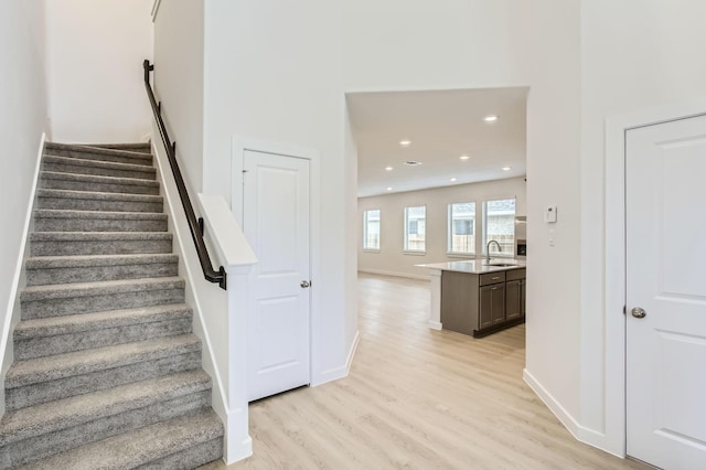 19367 Poppy Village Cir, Magnolia, TX 77355 - stairs featuring wood finished floors and recessed lighting