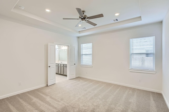 19367 Poppy Village Cir, Magnolia, TX 77355 - empty room featuring a raised ceiling, light colored carpet, ceiling fan, a smoke detector, and recessed lighting