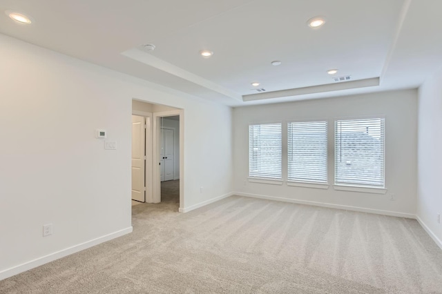 19367 Poppy Village Cir, Magnolia, TX 77355 - spare room with a raised ceiling, light colored carpet, recessed lighting, and a smoke detector
