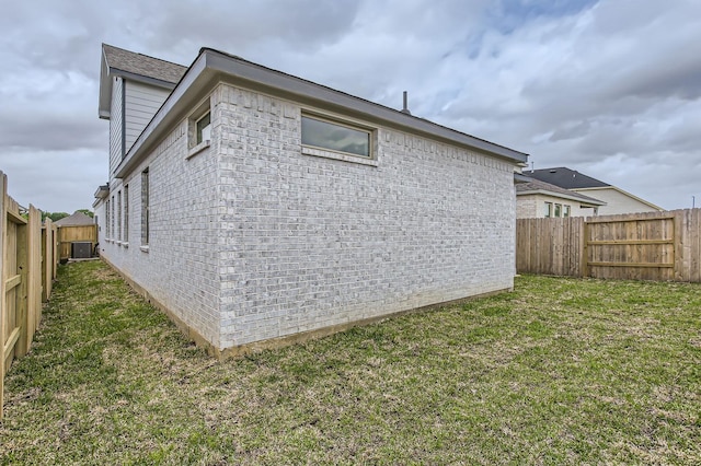19367 Poppy Village Cir, Magnolia, TX 77355 - view of side of home with brick siding and a fenced backyard