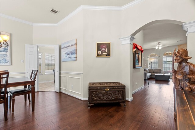423 Carson Ridge Dr, Spring, TX 77386 - dining area with arched walkways, crown molding, wood finished floors, decorative columns, and a ceiling fan