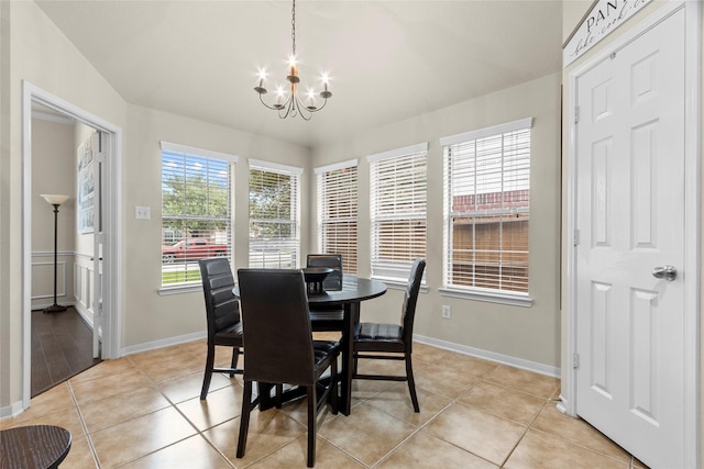 423 Carson Ridge Dr, Spring, TX 77386 - dining area featuring a chandelier and light tile patterned floors