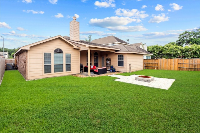 423 Carson Ridge Dr, Spring, TX 77386 - rear view of house featuring an outdoor living space with a fire pit, a patio area, a fenced backyard, and a chimney