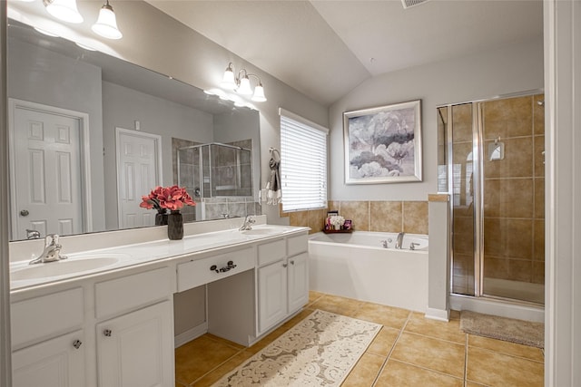 423 Carson Ridge Dr, Spring, TX 77386 - full bath with tile patterned flooring, a stall shower, double vanity, a bath, and vaulted ceiling