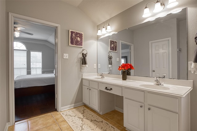 423 Carson Ridge Dr, Spring, TX 77386 - full bathroom featuring vaulted ceiling, double vanity, tile patterned flooring, ceiling fan, and ensuite bathroom