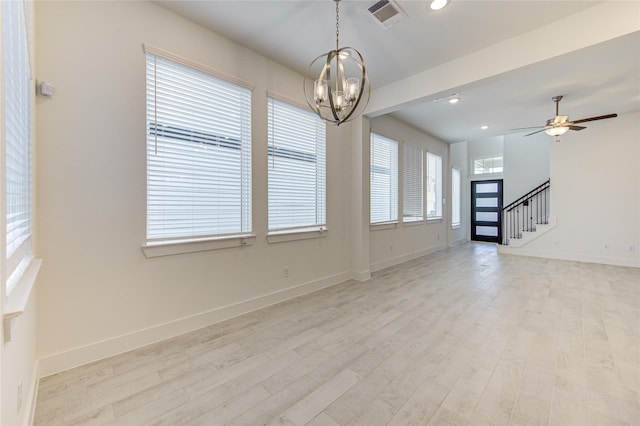21010 Garden Palm Dr, Cypress, TX 77433 - unfurnished living room featuring a chandelier, stairway, light wood-style floors, a ceiling fan, and recessed lighting