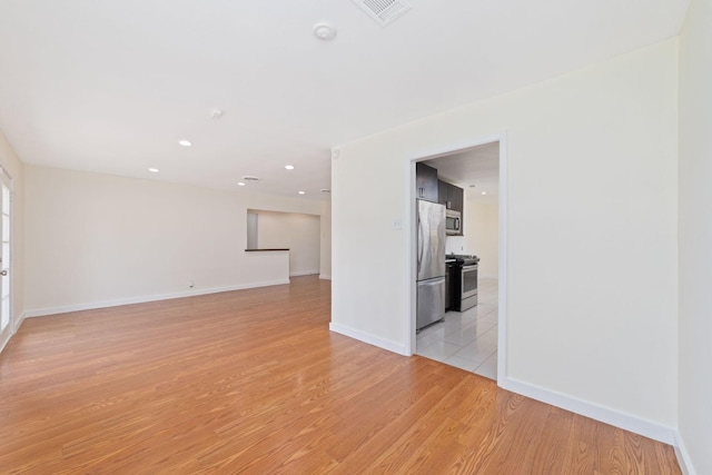 6234 Shadow Crest St, Houston, TX 77074 - empty room featuring light wood-style flooring and recessed lighting