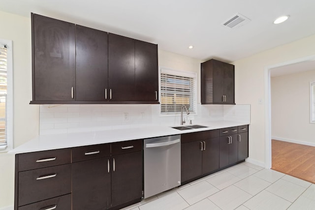 6234 Shadow Crest St, Houston, TX 77074 - kitchen featuring dishwasher, light countertops, decorative backsplash, dark brown cabinetry, and recessed lighting
