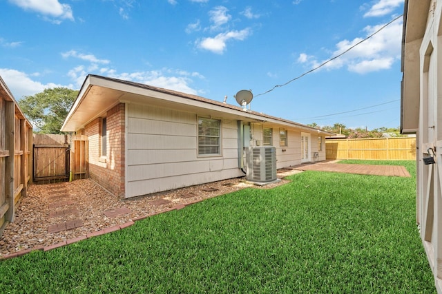 6234 Shadow Crest St, Houston, TX 77074 - back of property featuring brick siding, a fenced backyard, a gate, and a patio