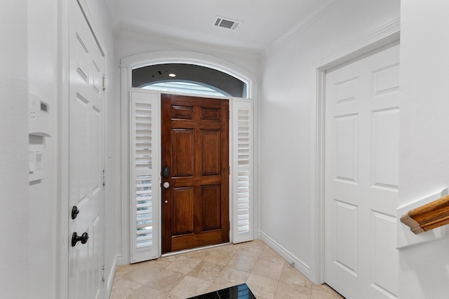 1908 Greenwich Place Dr, Houston, TX 77019 - entrance foyer with light tile patterned floors and crown molding