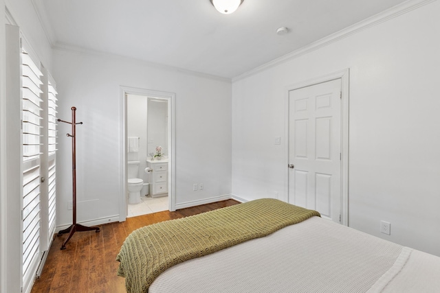 1908 Greenwich Place Dr, Houston, TX 77019 - bedroom with ornamental molding, wood finished floors, and connected bathroom