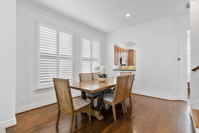 1908 Greenwich Place Dr, Houston, TX 77019 - dining area featuring dark wood-style flooring, ornamental molding, and recessed lighting