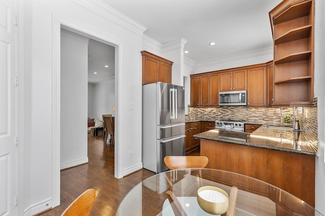 1908 Greenwich Place Dr, Houston, TX 77019 - kitchen featuring appliances with stainless steel finishes, open shelves, brown cabinets, dark wood-style floors, and dark stone countertops