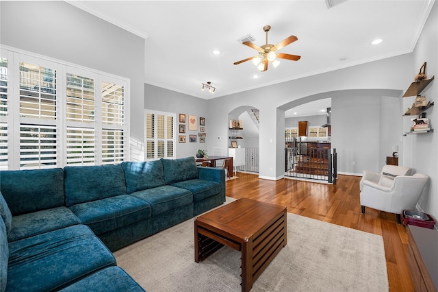 2043 W 14th 1/2 St, Houston, TX 77008 - living area with arched walkways, ceiling fan, wood finished floors, recessed lighting, and crown molding