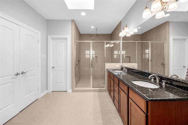 2043 W 14th 1/2 St, Houston, TX 77008 - full bathroom featuring a shower stall, double vanity, a skylight, tile patterned flooring, and recessed lighting